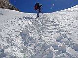 Rolwaling 07 10 Climbing Sherpa Palden Cutting Steps On Steep Snow On Climb To Tashi Lapcha Pass Climbing Sherpa Palden cut steps to ensure we had a safe place to step and not fall back down the face on an especially steep section of the climb to the Tashi (Tesi) Lapcha pass.